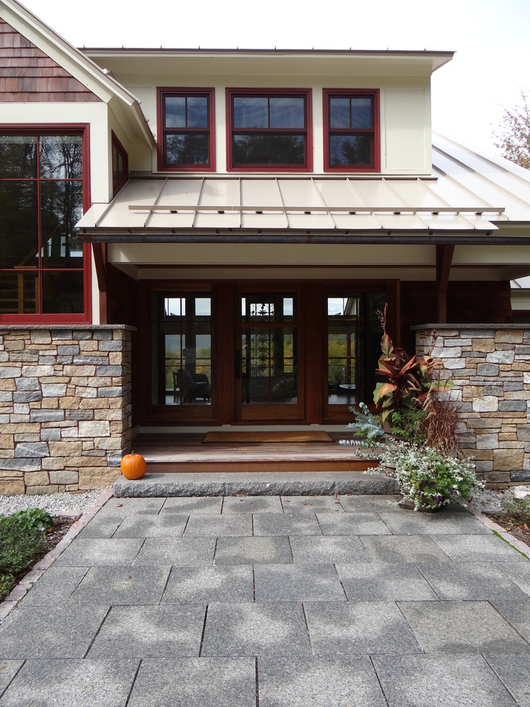 Inspiration for a contemporary house exterior in Boston with stone cladding.