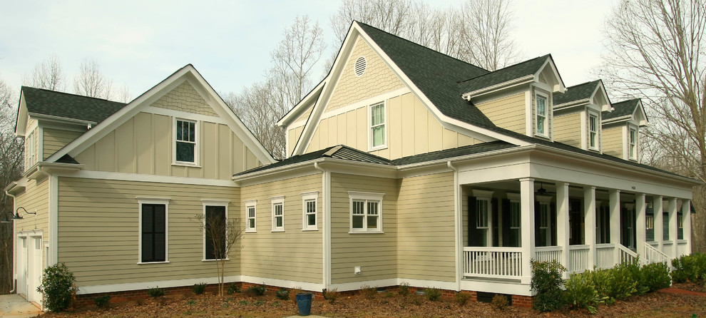 Design ideas for a farmhouse two floor house exterior in Charlotte.