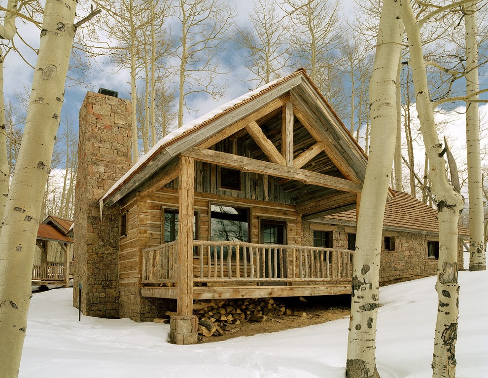 Inspiration for a rustic one-story mixed siding exterior home remodel in Denver