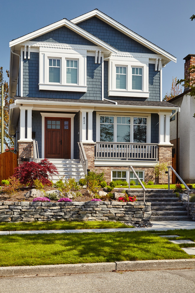 Craftsman blue three-story gable roof idea in Vancouver
