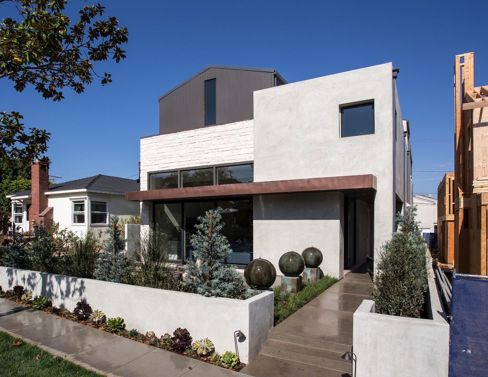 Idéer för mellanstora funkis grå hus, med två våningar, blandad fasad, sadeltak och tak i metall