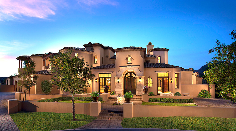 Inspiration for a huge mediterranean multicolored two-story mixed siding exterior home remodel in Phoenix with a mixed material roof