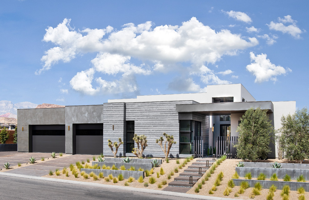 Inspiration for a contemporary gray one-story concrete exterior home remodel in Las Vegas