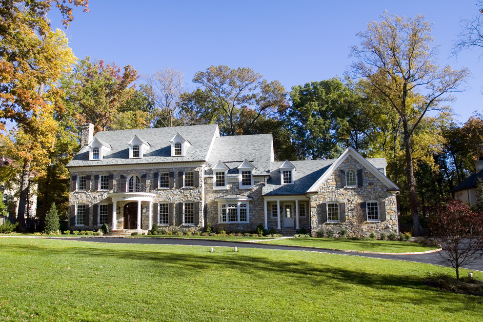 Inspiration for a huge timeless beige three-story stone exterior home remodel in DC Metro