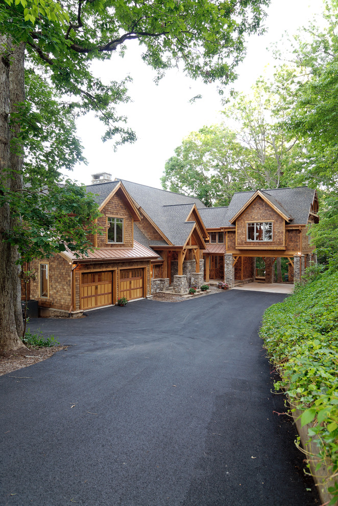 Design ideas for a large rustic two floor house exterior in New York with wood cladding.