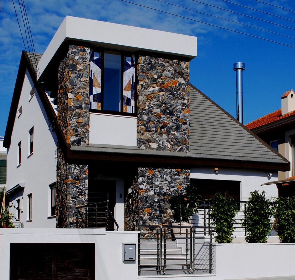 Contemporary two floor house exterior in Other with mixed cladding.