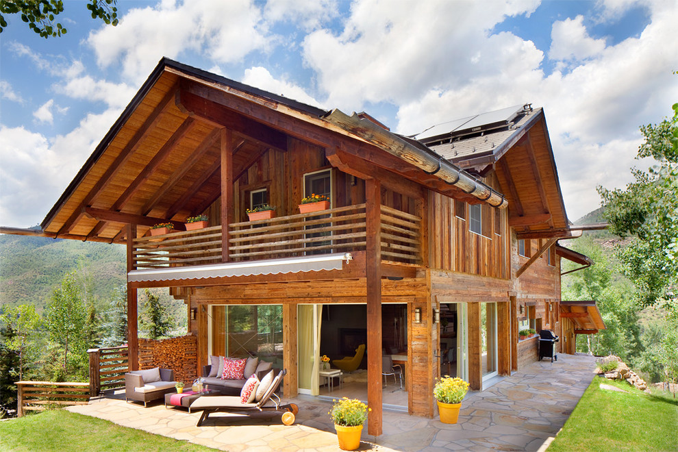 Inspiration for a large rustic brown two-story wood exterior home remodel in Denver