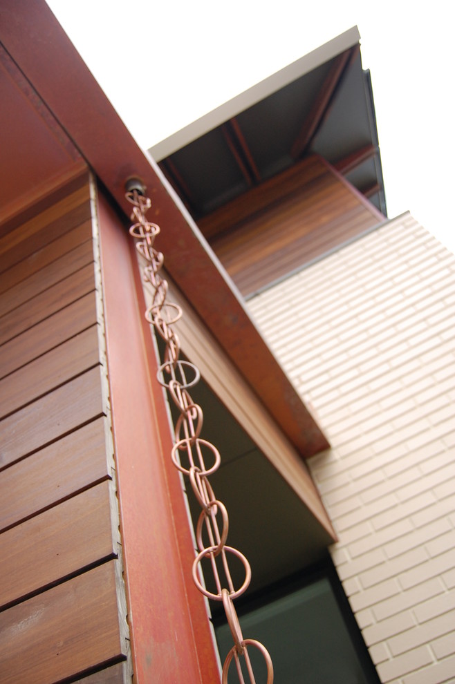 Large modern brown two-story mixed siding exterior home idea in Richmond