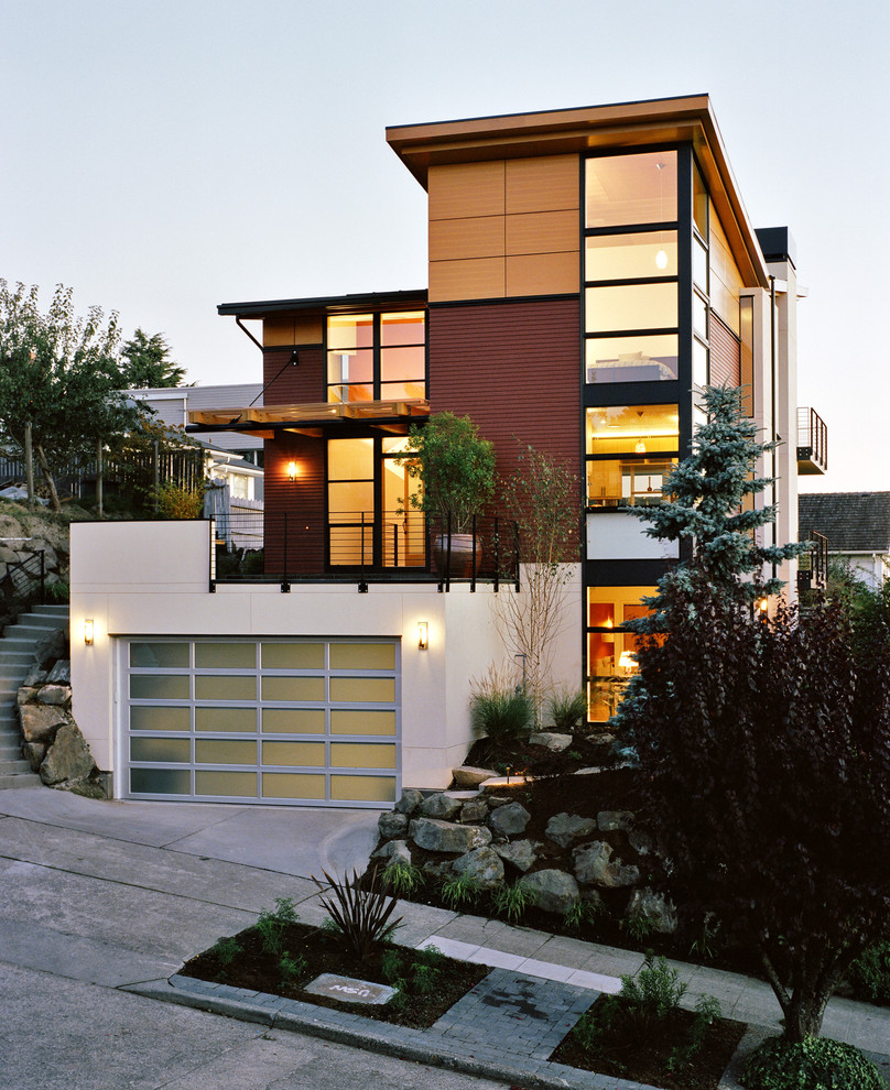 Design ideas for a contemporary house exterior in Seattle with three floors.