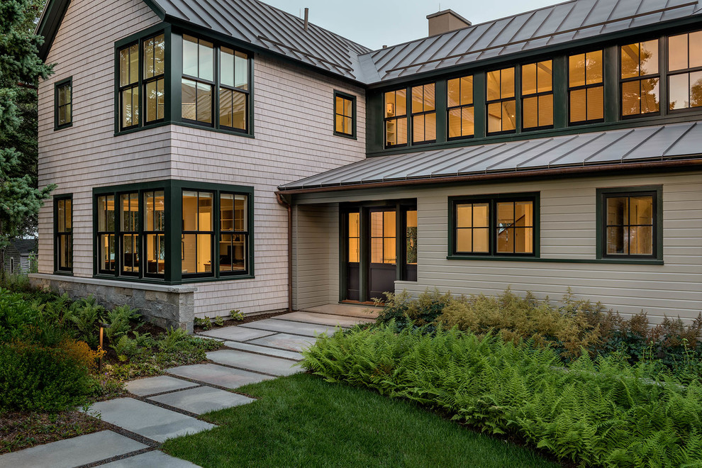 Large coastal gray two-story wood gable roof idea in DC Metro