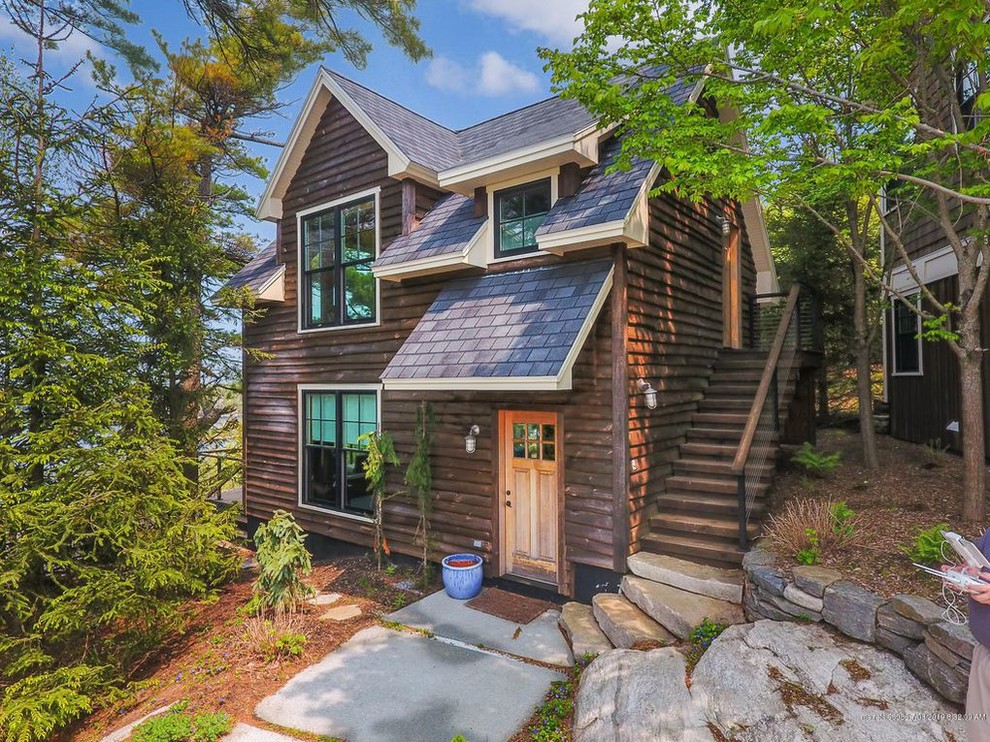 Photo of a small and brown rustic two floor detached house in Portland Maine with wood cladding, a hip roof and a shingle roof.