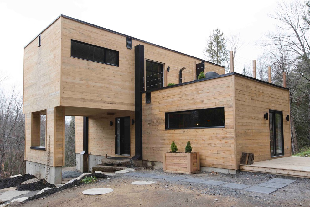 Example of an urban exterior home design in Montreal