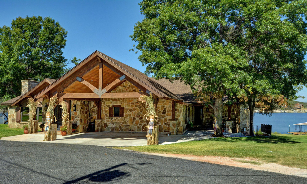 Example of a mountain style one-story stone exterior home design in Dallas