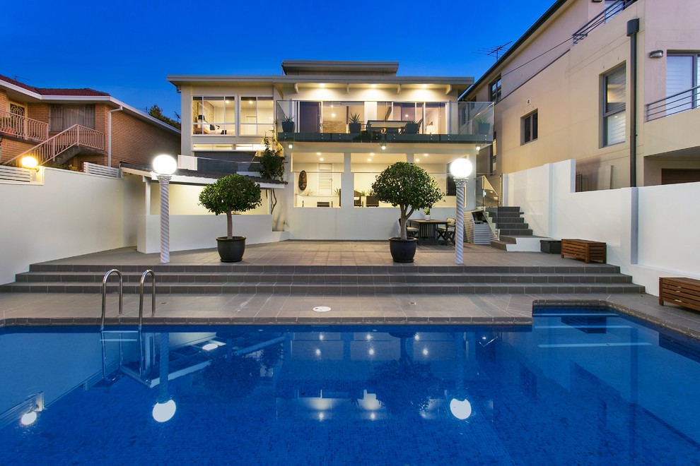 This is an example of a white classic two floor house exterior in Sydney.