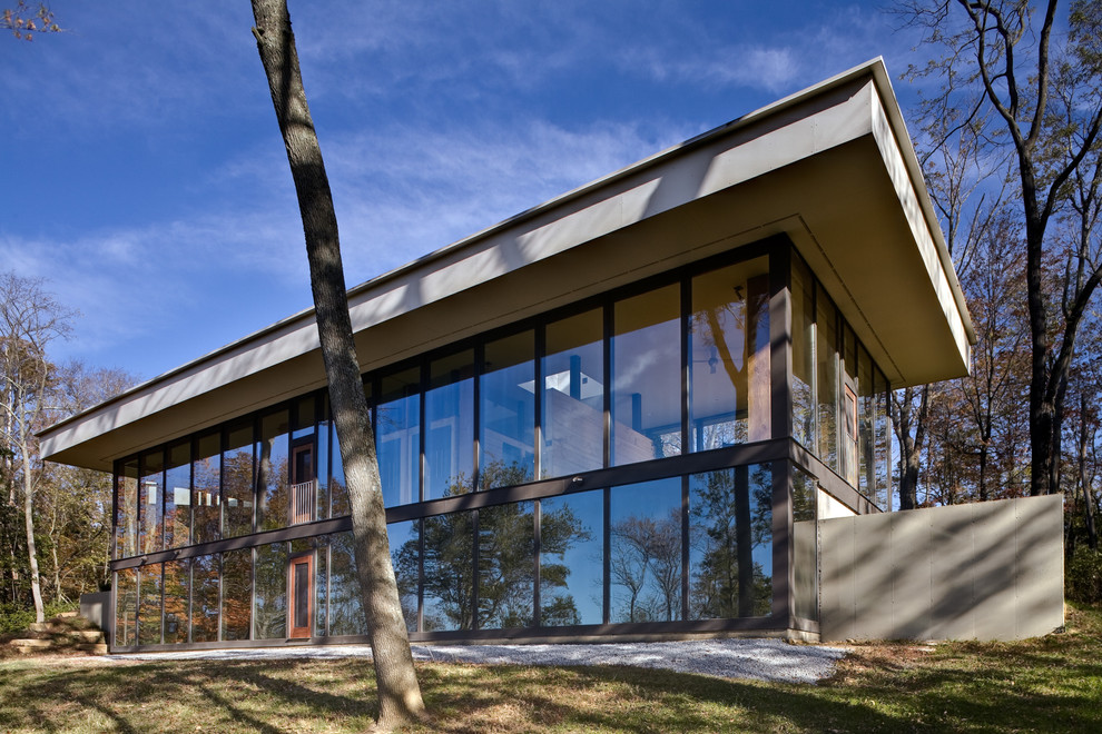Design ideas for a modern two floor glass house exterior in Cincinnati.