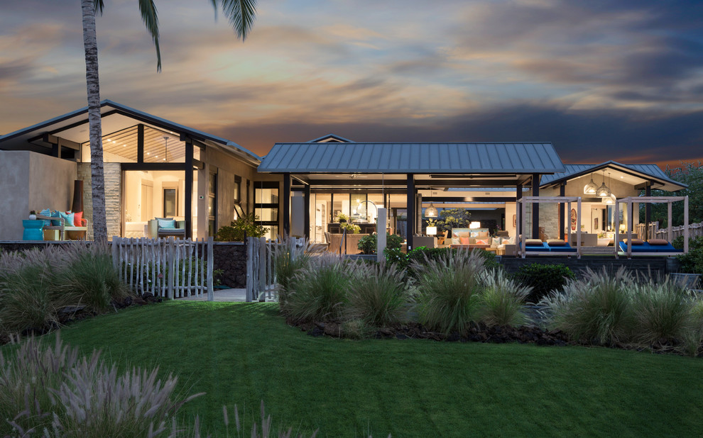 Inspiration for an expansive and multi-coloured contemporary bungalow detached house in Hawaii with stone cladding, a pitched roof and a metal roof.