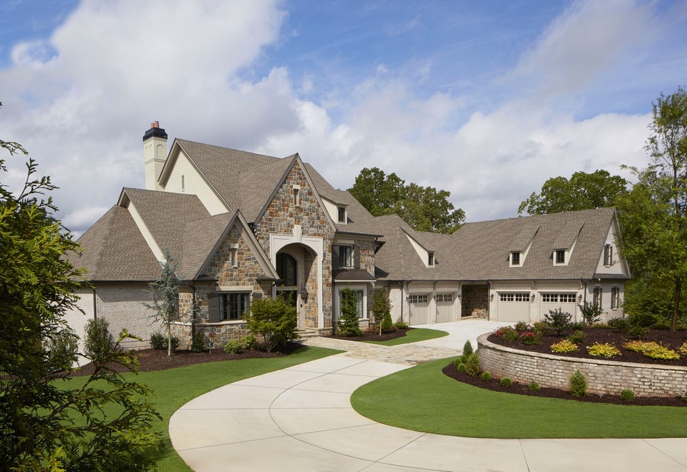 Inspiration for a huge timeless gray three-story brick exterior home remodel in Atlanta