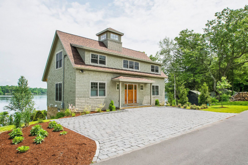 Inspiration for a mid-sized timeless gray two-story wood gable roof remodel in Burlington
