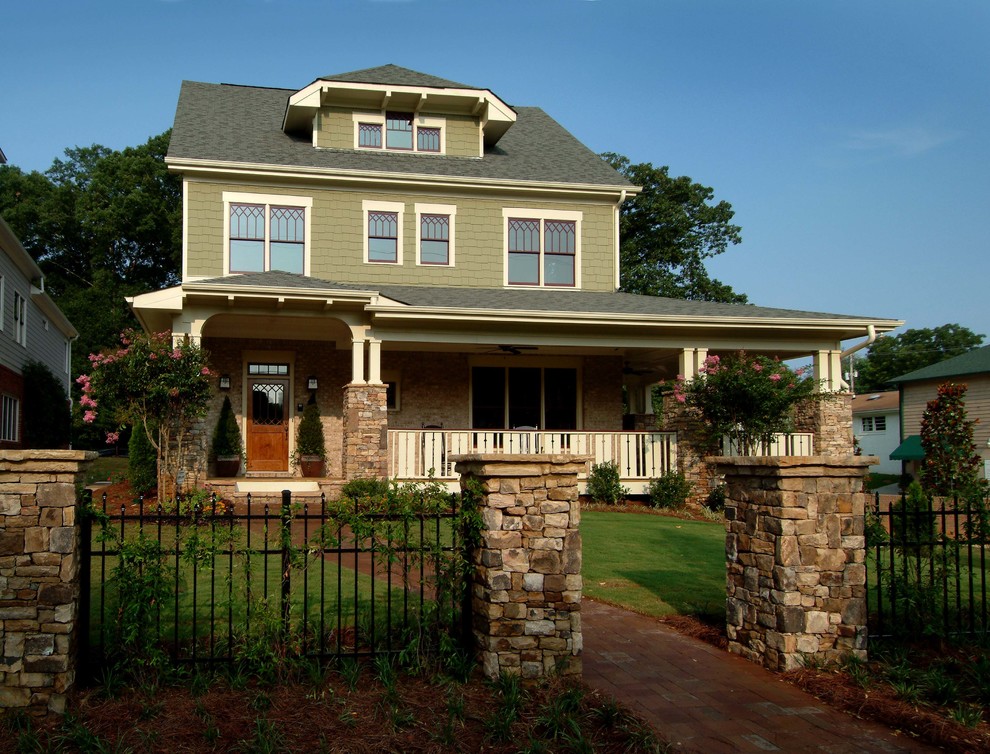 Mid-sized arts and crafts green three-story wood house exterior photo in Atlanta with a clipped gable roof and a shingle roof