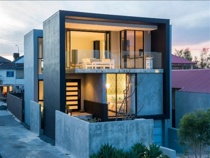 Example of a mid-sized trendy exterior home design in Perth