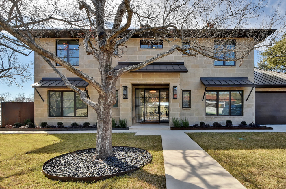 Inspiration for a contemporary two-story stone exterior home remodel in Austin