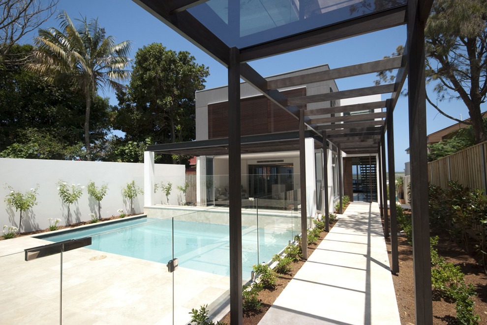 Inspiration for a modern wood exterior home remodel in Sydney