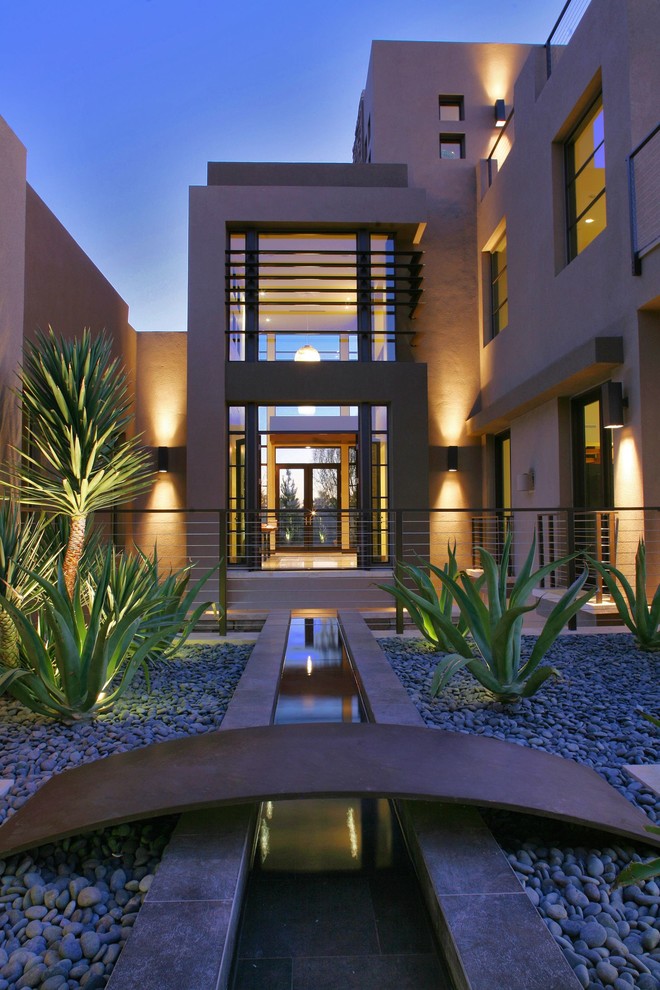 Inspiration for a contemporary house exterior in Las Vegas with three floors.