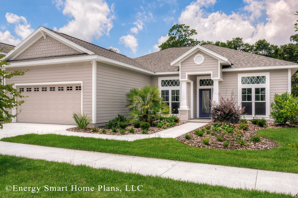 Inspiration for a small craftsman beige one-story vinyl exterior home remodel in Orlando