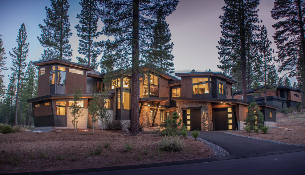 Mountain style brown two-story wood house exterior photo in Sacramento with a shed roof