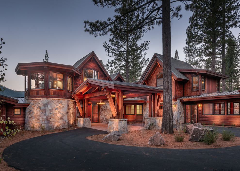 Photo of a large and brown rustic two floor house exterior in Sacramento with mixed cladding and a hip roof.