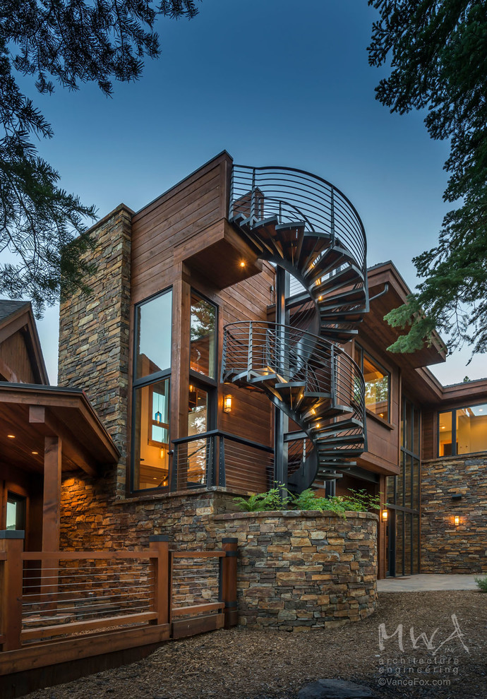 Huge contemporary brown three-story mixed siding exterior home idea in Other with a mixed material roof