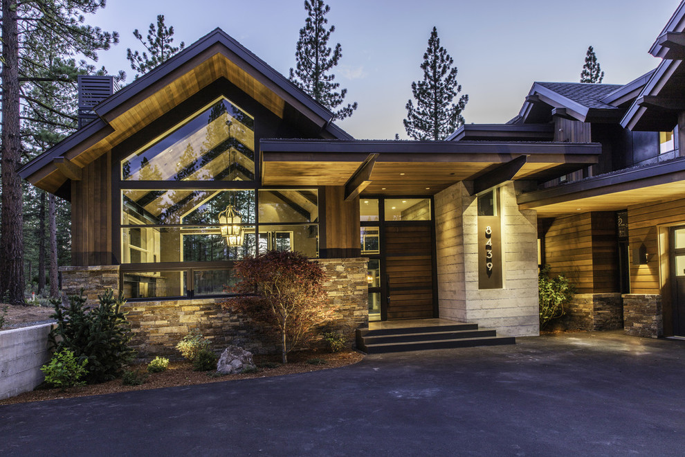 Inspiration for a rustic two floor house exterior in San Francisco with wood cladding.