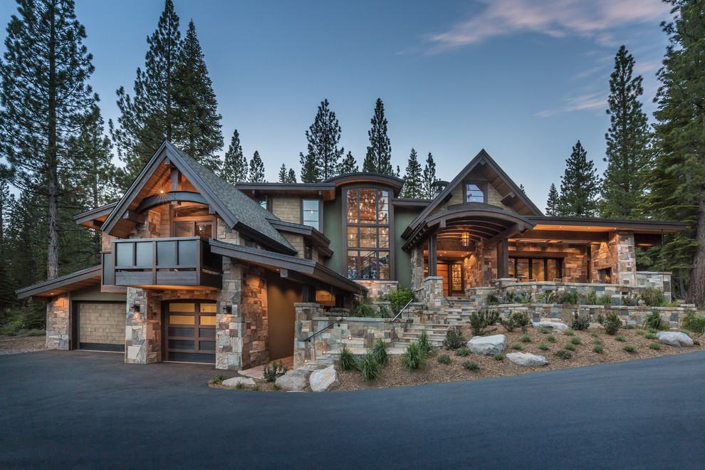 Expansive rustic house exterior in Sacramento with three floors and stone cladding.