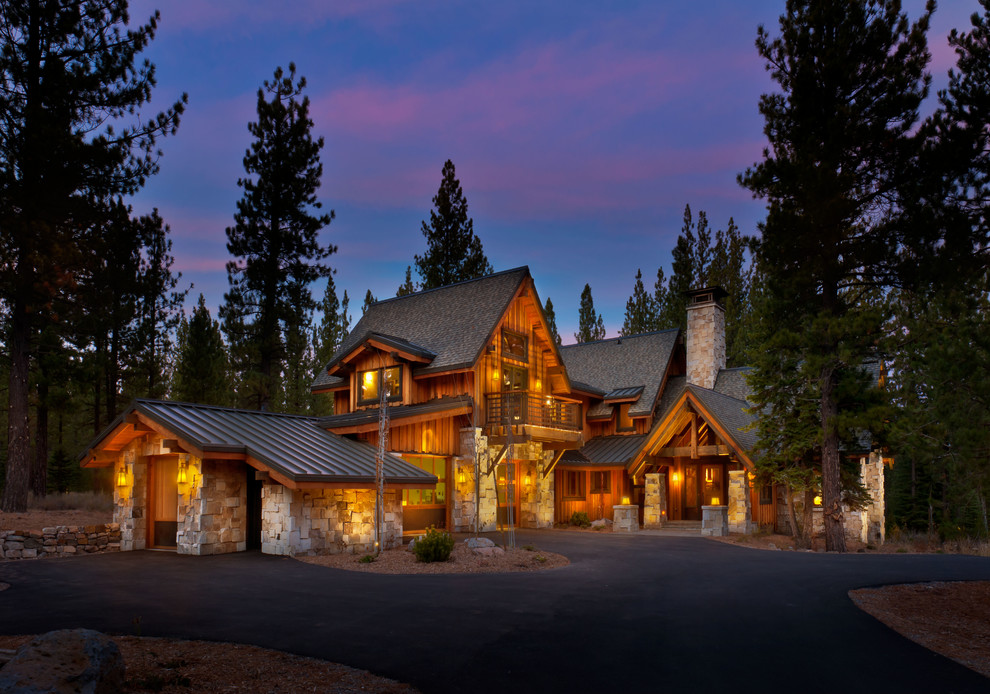 Huge mountain style brown two-story wood exterior home photo in Sacramento with a mixed material roof