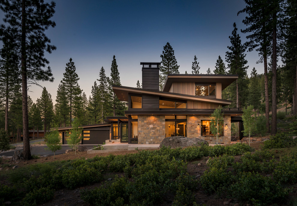Large rustic brown two-story wood house exterior idea in Sacramento with a shed roof and a metal roof