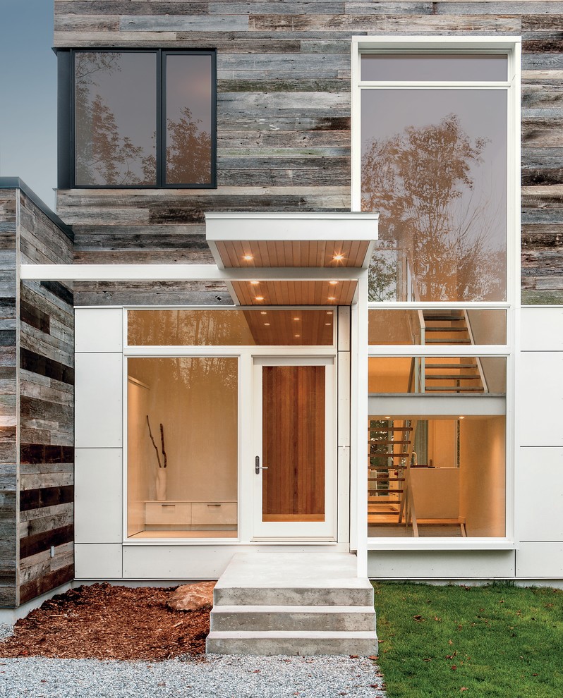 Contemporary white exterior home idea in Montreal