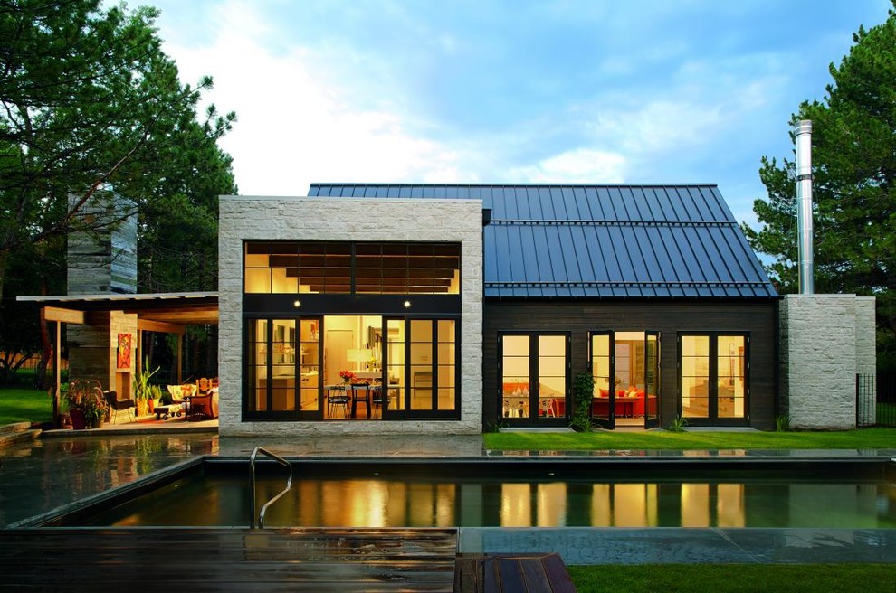 Mid-sized transitional brown two-story wood exterior home photo in Atlanta with a metal roof