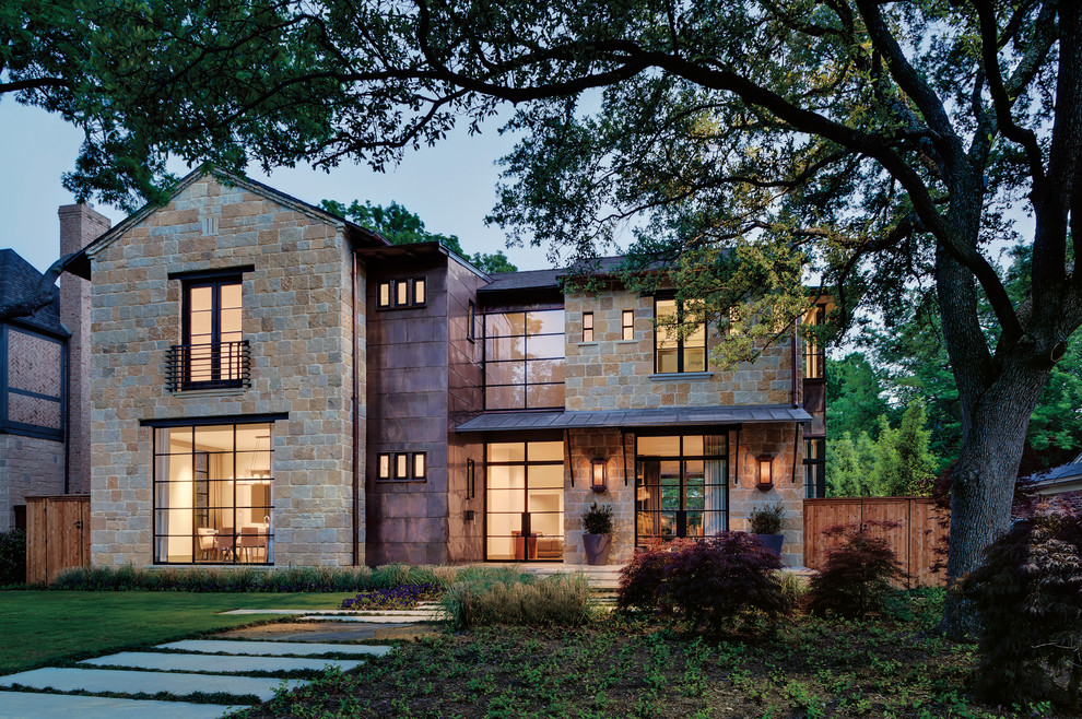 Large eclectic brown two-story mixed siding exterior home photo in Austin