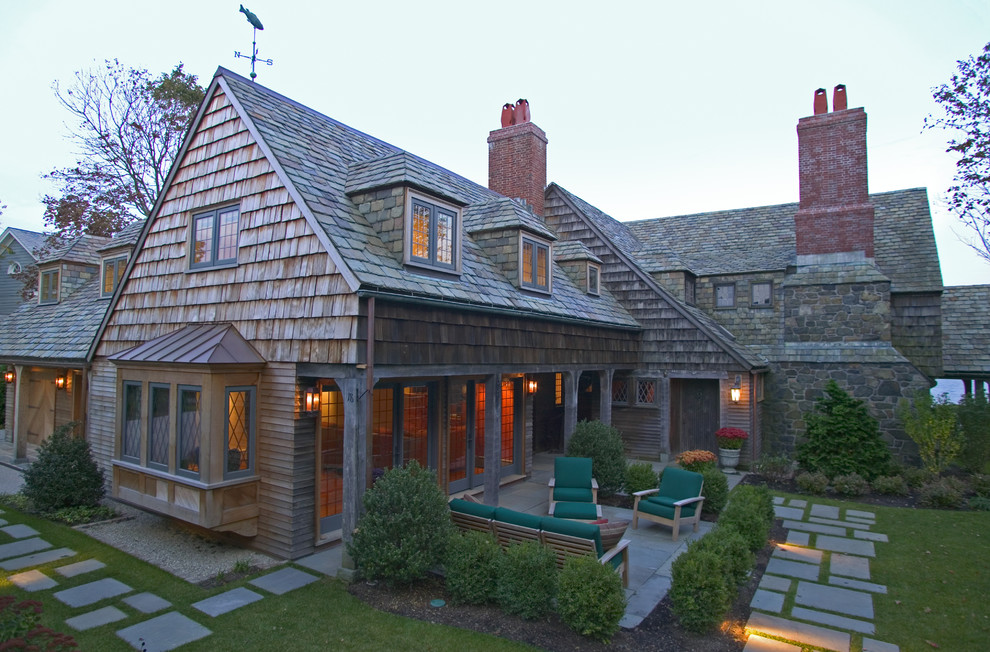 Inspiration for a large timeless two-story wood gable roof remodel in Boston