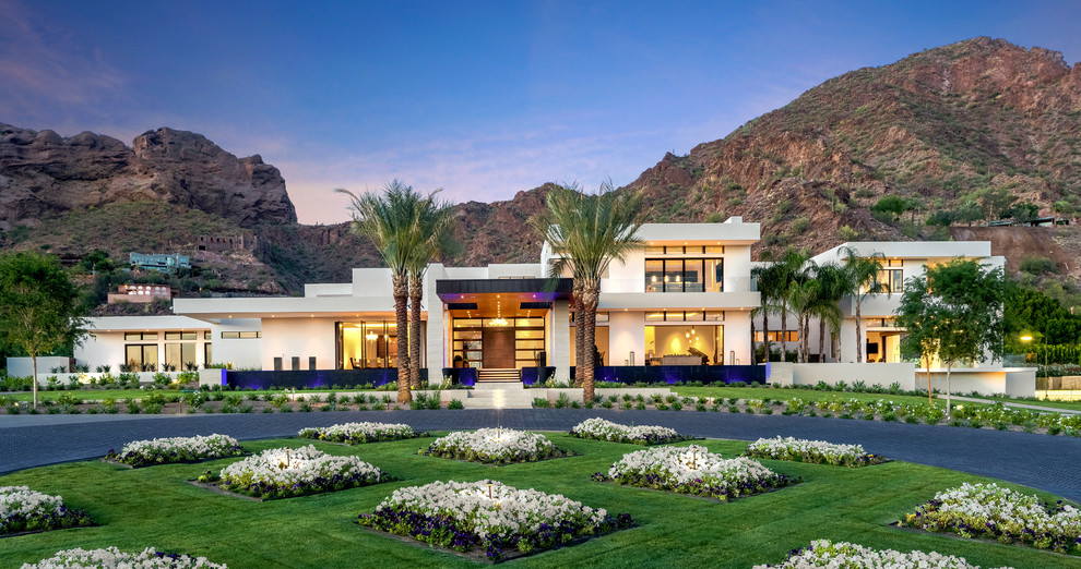 Design ideas for an expansive contemporary house exterior in Phoenix.