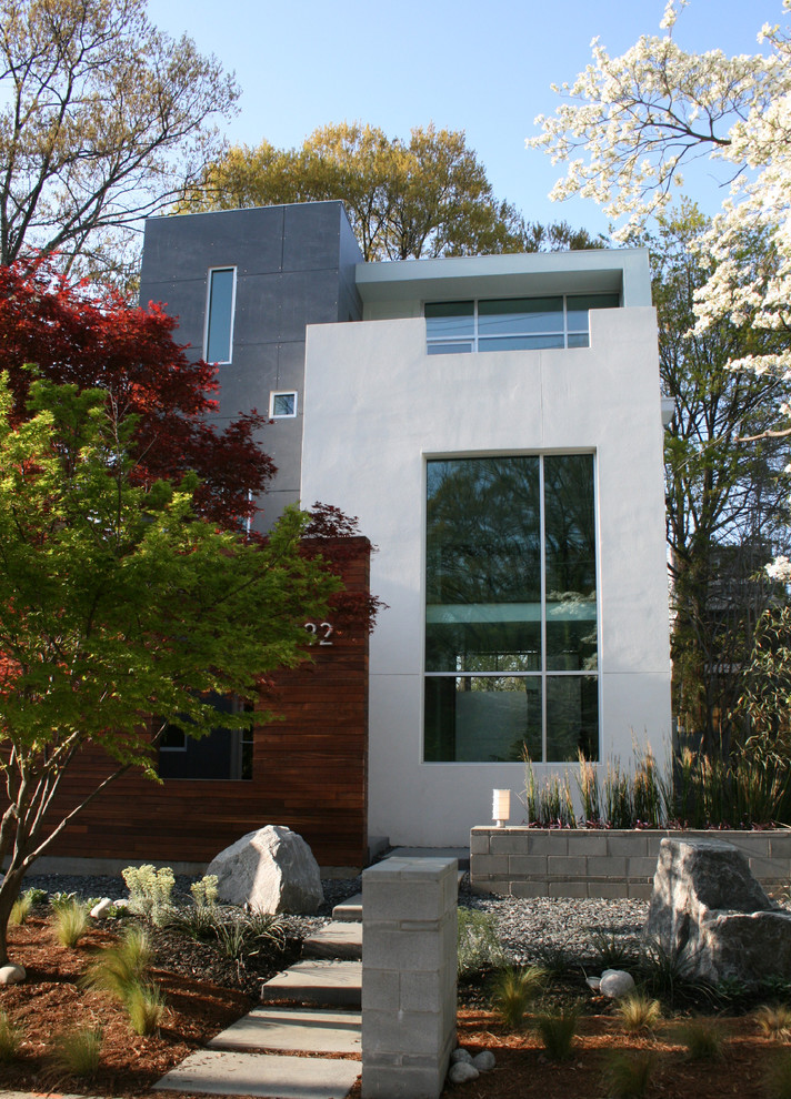 Design ideas for a modern house exterior in Atlanta with wood cladding.
