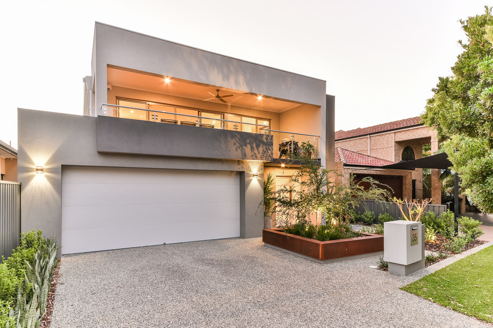 Photo of a medium sized and gey modern two floor brick house exterior in Perth with a flat roof.