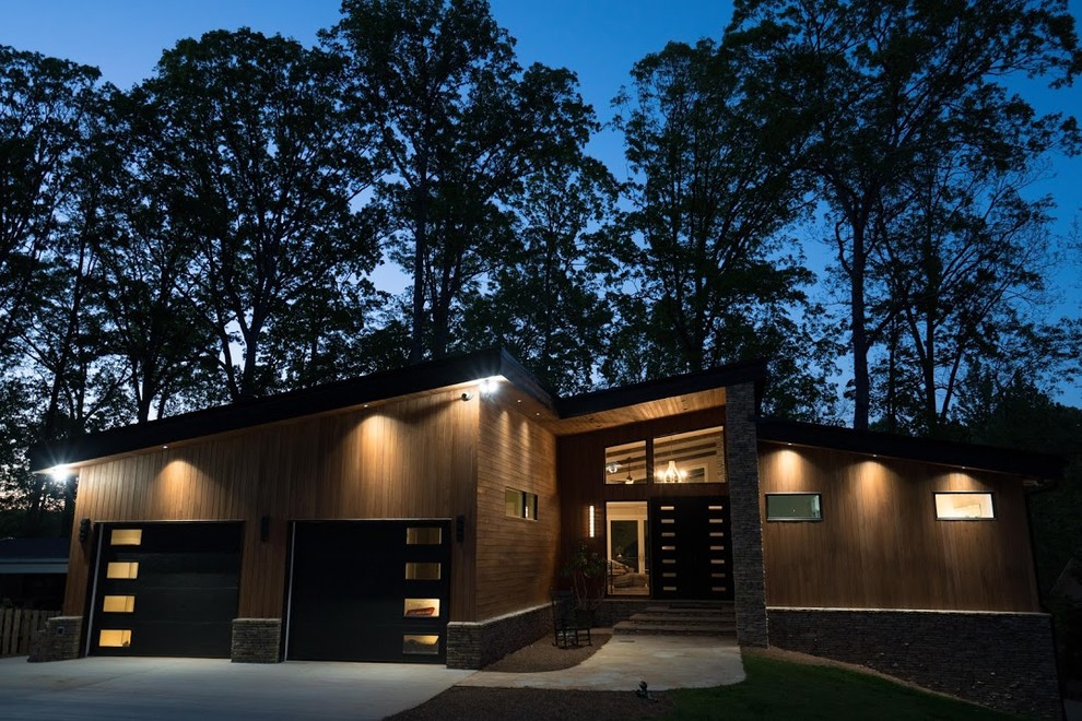 Inspiration for a mid-sized modern brown two-story wood exterior home remodel in Atlanta with a shed roof
