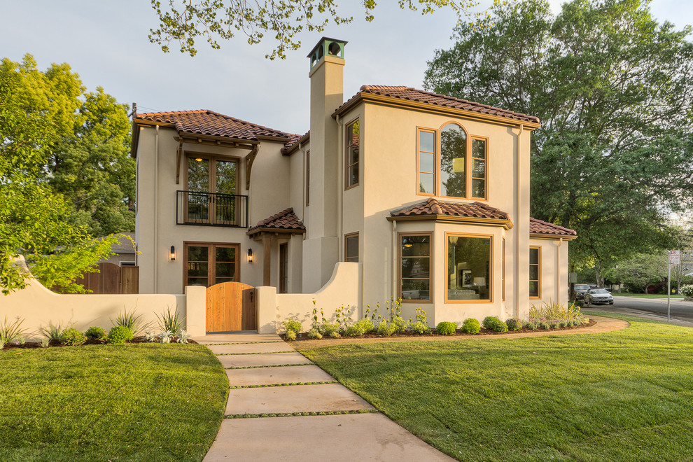 Mediterranean beige two-story stucco exterior home idea in Sacramento with a hip roof