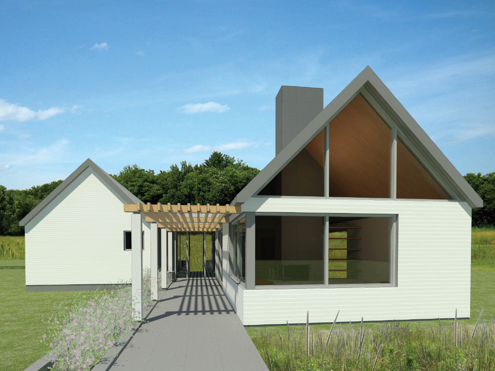 Immagine della villa piccola bianca moderna a un piano con rivestimento in legno, tetto a capanna e copertura in metallo o lamiera