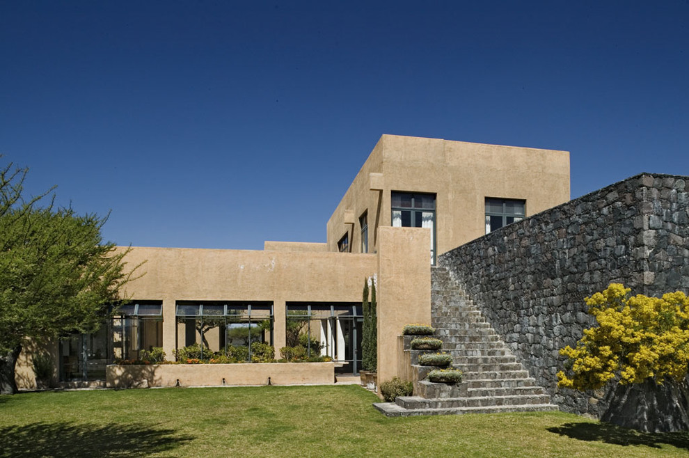 Inspiration for a mediterranean two-story flat roof remodel in New York