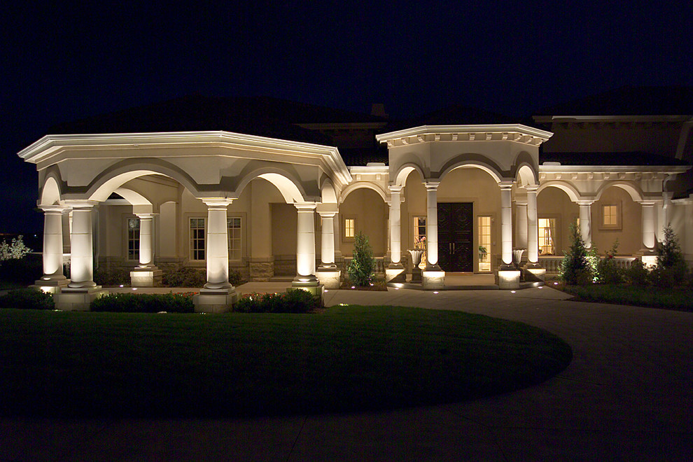 Huge tuscan beige two-story stucco exterior home photo in Omaha