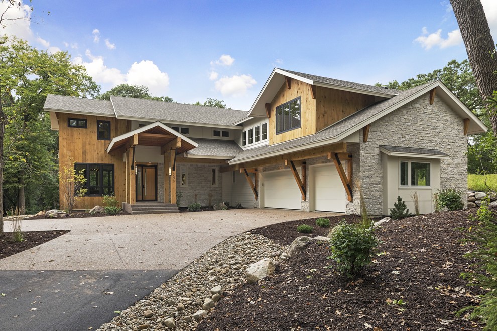 Inspiration for a mid-sized contemporary gray two-story mixed siding exterior home remodel in Minneapolis with a shingle roof