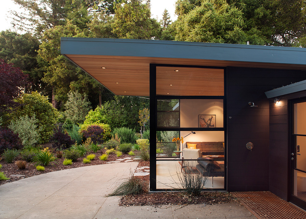 This is an example of a brown contemporary bungalow glass house exterior in San Francisco.