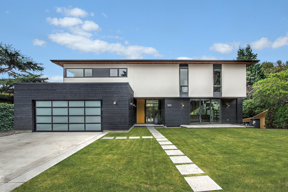 Contemporary two floor house exterior in Seattle with mixed cladding.